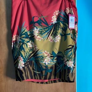 Printed mini skirt. Beautiful multi colored. Slit in the back.